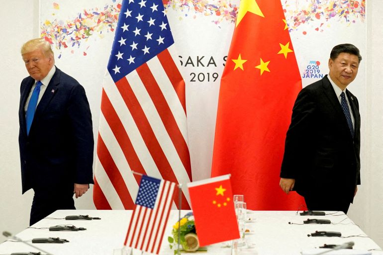 FILE PHOTO: FILE PHOTO: U.S. President Donald Trump attends a bilateral meeting with China's President Xi Jinping during the G20 leaders summit in Osaka, Japan, حزيران 29, 2019. REUTERS/Kevin Lamarque/File Photo/File Photo