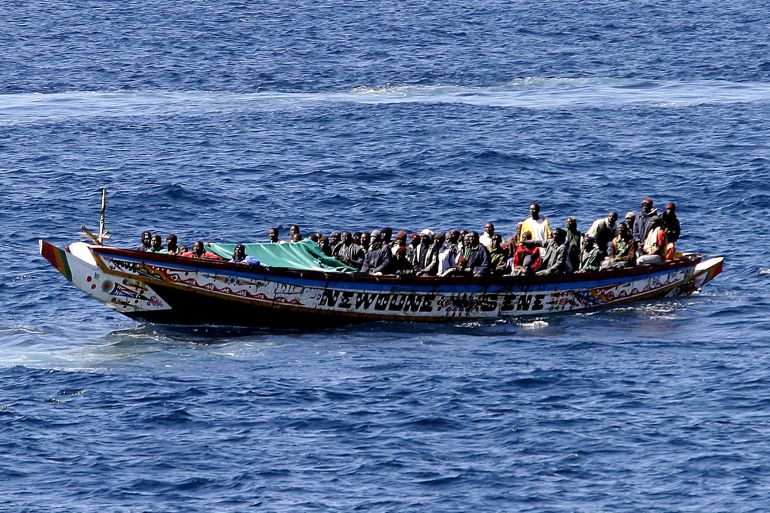 ارشيف A boat, with 74 would-be immigrants on board, arrives from Mauritania escorted by Spanish police, at the port of Los Cristianos in the Spanish Canary Island of Tenerife, آذار 21, 2006, after being intercepted off the island. More than 1,000 would-be immigrants have died trying to reach Spain's Canary Islands this year, the Red Cross estimates, as more and more Africans attempt to break into 'Fortress Europe' by using ever longer sea routes. REUTERS/Gsus Roper