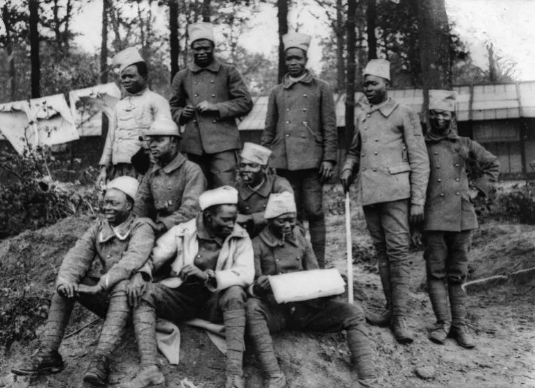 Senegalese riflemen rest during the First World War. These soldiers were the inspiration behind Banania’s first mascot [Roger Viollet via Getty Images]