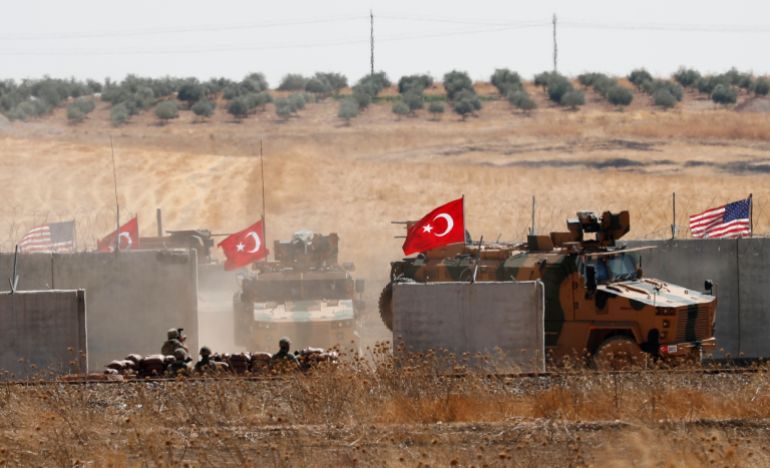Turkish troops return after a joint U.S.-Turkey patrol in northern Syria, as it is pictured from near the Turkish town of Akcakale, Turkey, أيلول 8, 2019. REUTERS/Murad Sezer