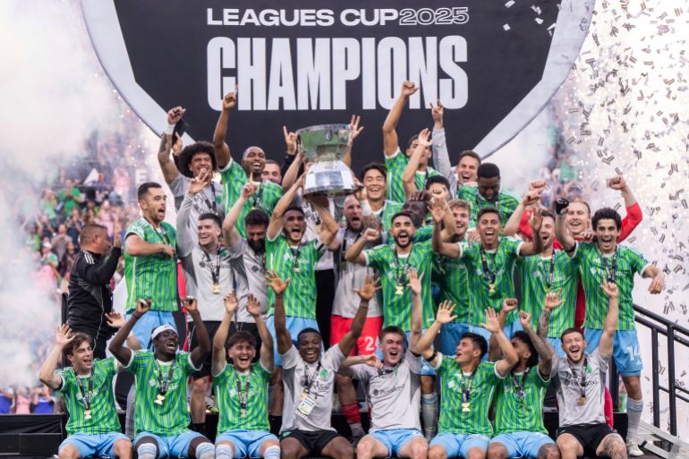 Seattle Sounders players celebrate after the Leagues Cup final soccer match against Inter Miami, Sunday, Aug. 31, 2025, in Seattle. (AP Photo/Stephen Brashear)