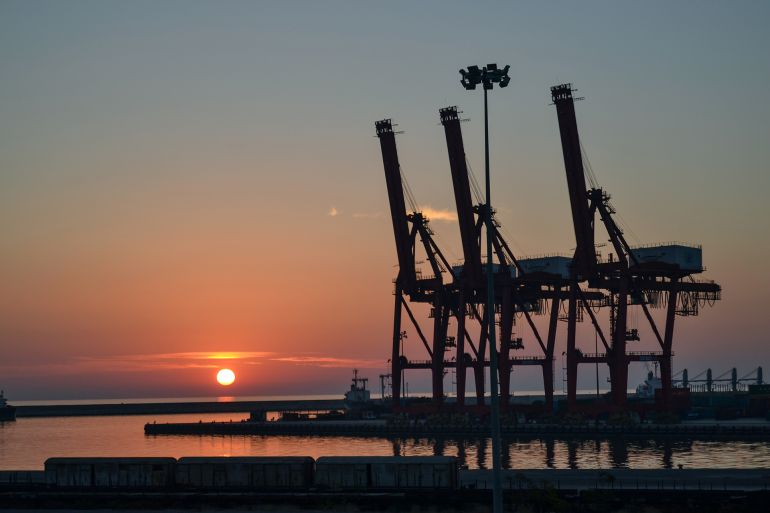 Latakia / Syria 07/04/2016: a port, seaport at sunset in silhouette